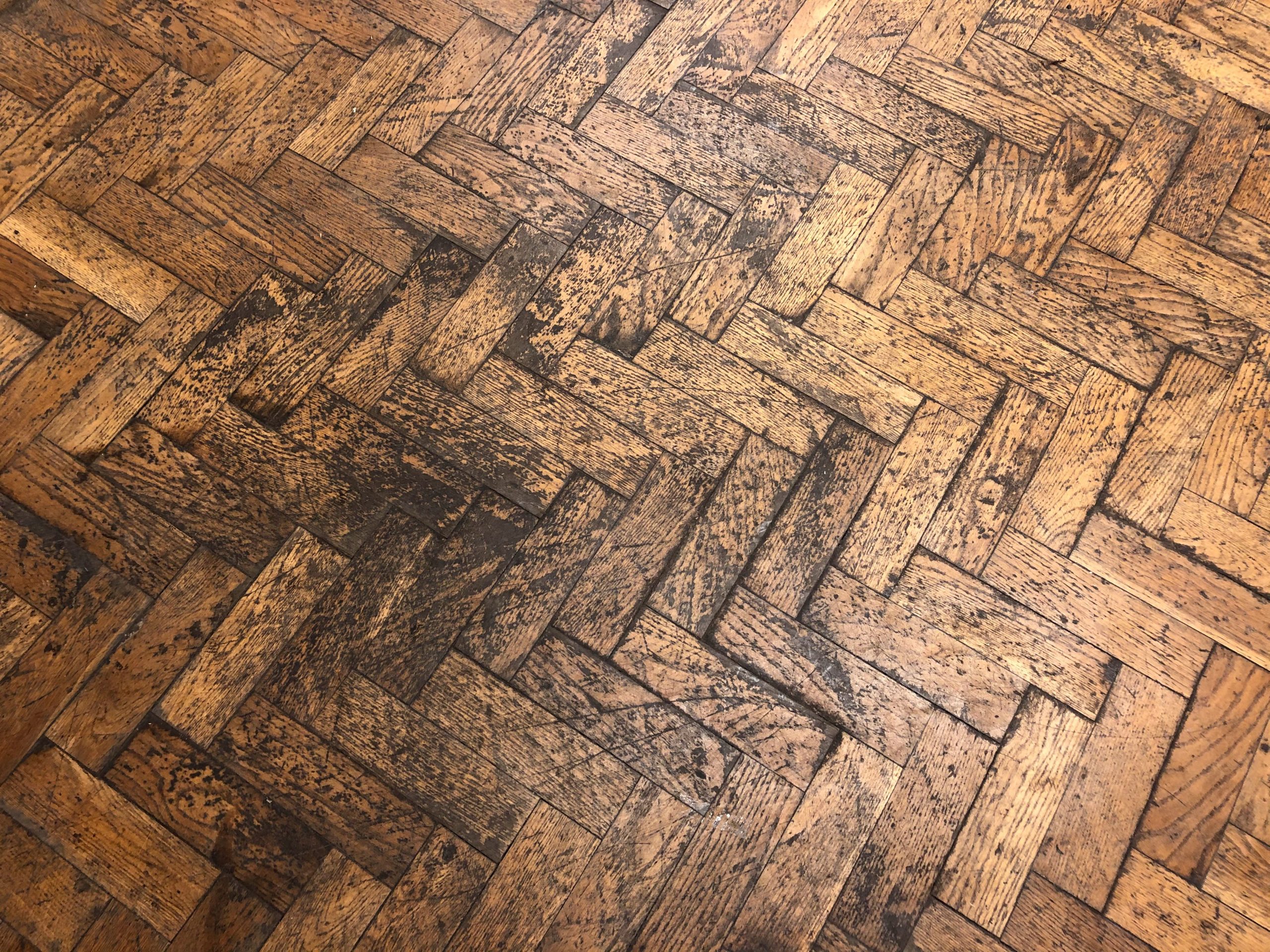 Badly worn timber floor